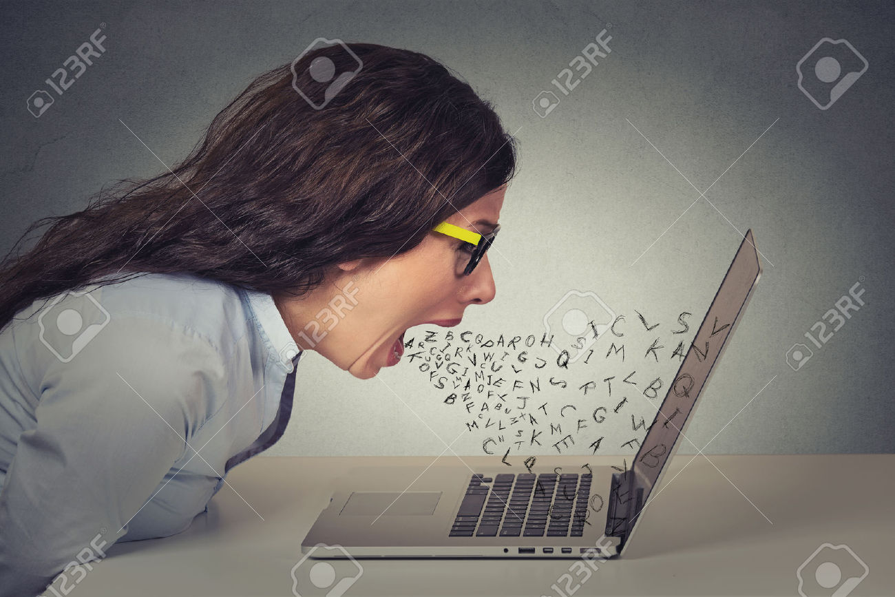46737925-angry-furious-businesswoman-working-on-computer-screaming-with-alphabet-letter-coming-out-of-open-mo-stock-photo